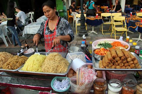 A street vendor cooks food on a street in central Bangkok, Thailand, Friday, April 22, 2016. In Bangkok, street food remains the heart and soul of local cuisine, sold day and night from carts and ...
